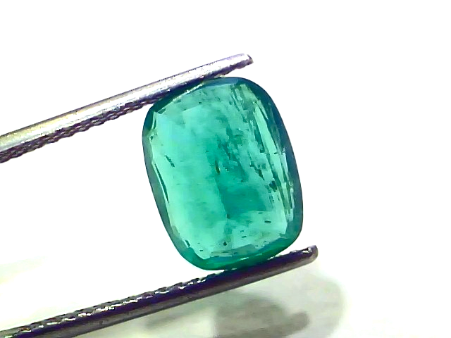 Natural Zambian emerald, 4.77 carats, GII certified, untreated, featuring a rectangular cut and vibrant green color.