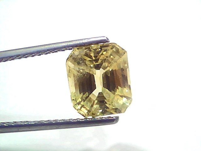5.02 carat GII certified Ceylon yellow sapphire (Pukhraj) in an emerald cut, showcasing a vibrant yellow hue.