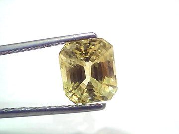 5.02 carat GII certified Ceylon yellow sapphire (Pukhraj) in an emerald cut, showcasing a vibrant yellow hue.