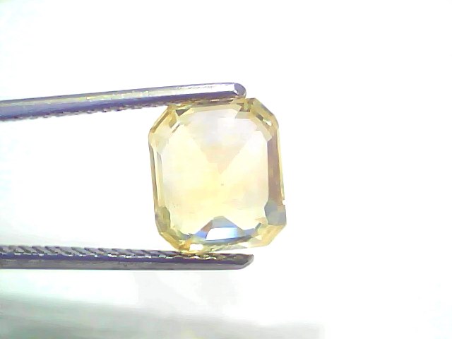 5.02 carat GII certified Ceylon yellow sapphire (Pukhraj) in an emerald cut, showcasing a vibrant yellow hue.