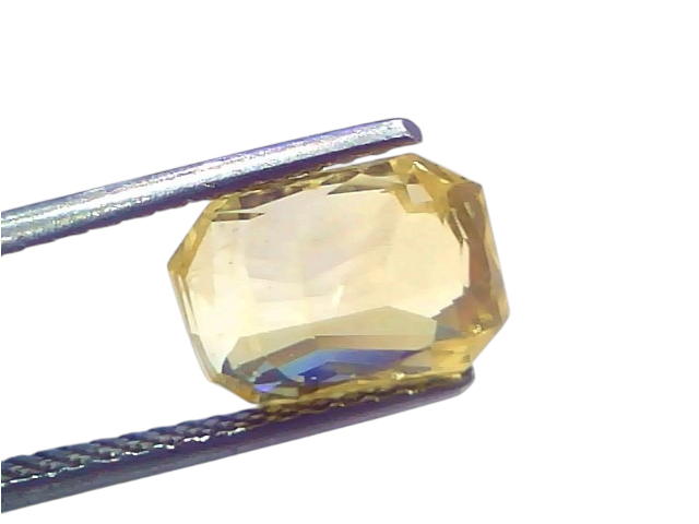 5.08 Ct IGI Certified Unheated Natural Ceylon Yellow Sapphire Pukhraj displayed in tweezers, showcasing its octagonal cut and