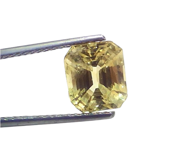 5.02 carat GII certified Ceylon yellow sapphire (Pukhraj) in an emerald cut, showcasing a vibrant yellow hue.