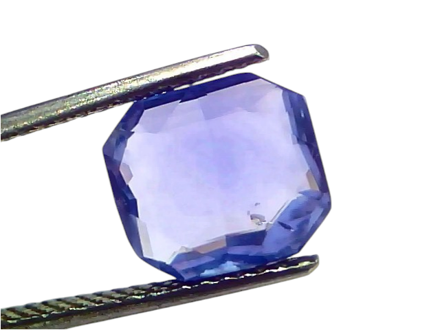 5.32 carat IGI certified unheated natural Ceylon blue sapphire, octagonal cut, held with tweezers against a white background.
