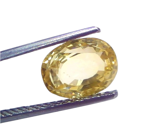 5.04 Ct IGI Certified Unheated Natural Ceylon Yellow Sapphire Pukhraj, oval-cut, held by tweezers, showcasing its vibrant yel