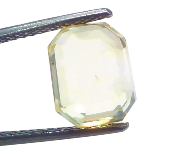 6.11 Ct IGI Certified Unheated Natural Ceylon Yellow Sapphire Pukhraj, octagonal cut, held with tweezers against a light back
