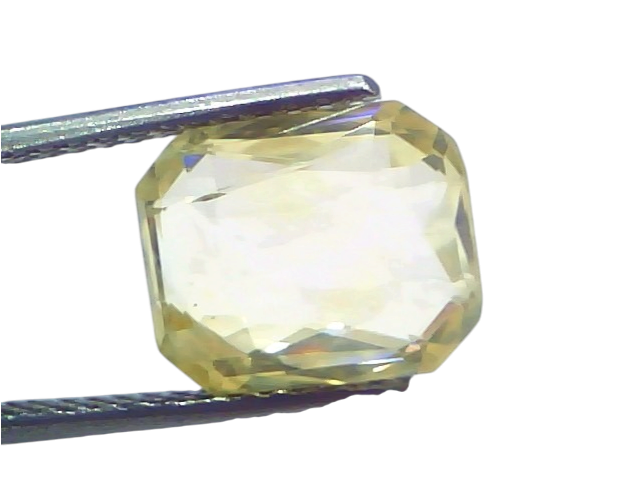 6.00 Ct IGI Certified Unheated Natural Ceylon Yellow Sapphire Pukhraj, octagonal cut, held with tweezers against a light back