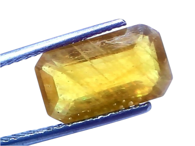 6.94 carat certified natural yellow sapphire Pukhraj stone, heated, displayed in tweezers, showcasing its vibrant yellow hue.