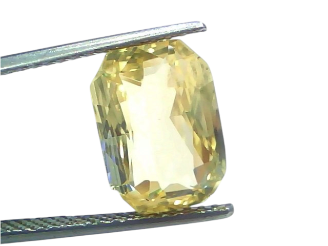 8.04 Ct IGI Certified Unheated Natural Ceylon Yellow Sapphire Pukhraj displayed in tweezers, showcasing its brilliant yellow