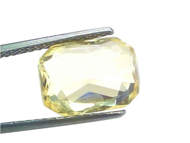 8.04 Ct IGI Certified Unheated Natural Ceylon Yellow Sapphire Pukhraj, octagonal cut, held with tweezers against a white back