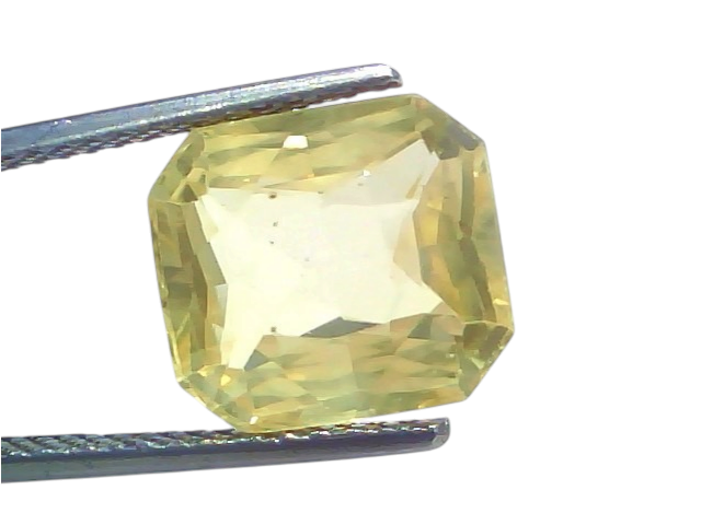 8.52 Ct IGI Certified Unheated Natural Ceylon Yellow Sapphire Pukhraj, octagonal cut, held with tweezers against a white back
